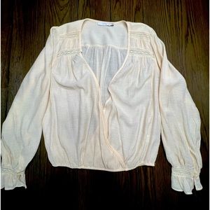 Beautiful Bohemian beige long-sleeve deep-cut cinched at the wrist top by Lush.